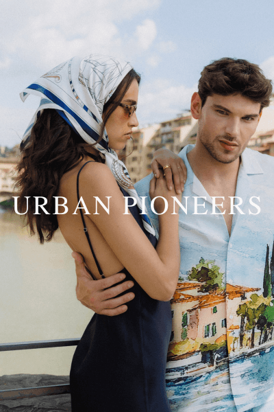 Kvinne og mann stående ute med klær fra Urban Pioneers